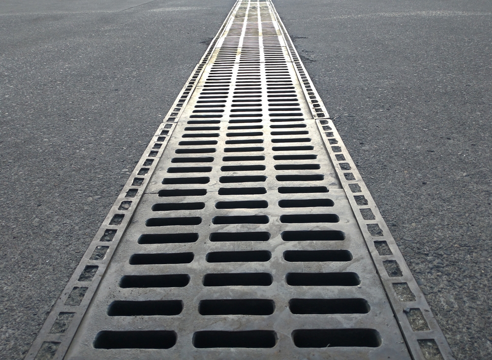 Iron,metal,stormwater,drainage,on,airport,apron,concrete,surface.the,system